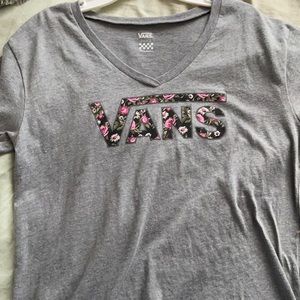 A Vans shirt that is a size small in women’s